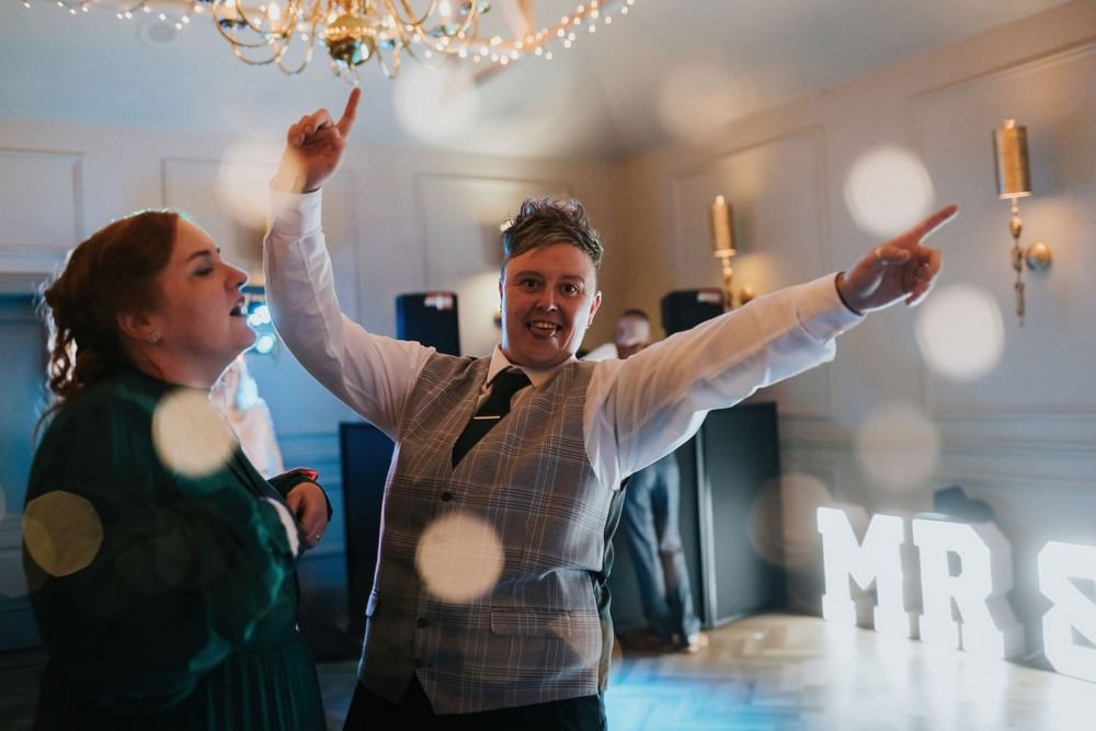 briar court hotel wedding guest with hands in air