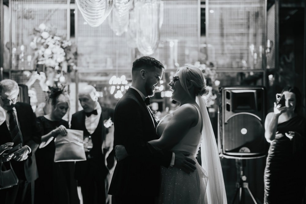 bride and groom backlit on dancefloor at holmes mill