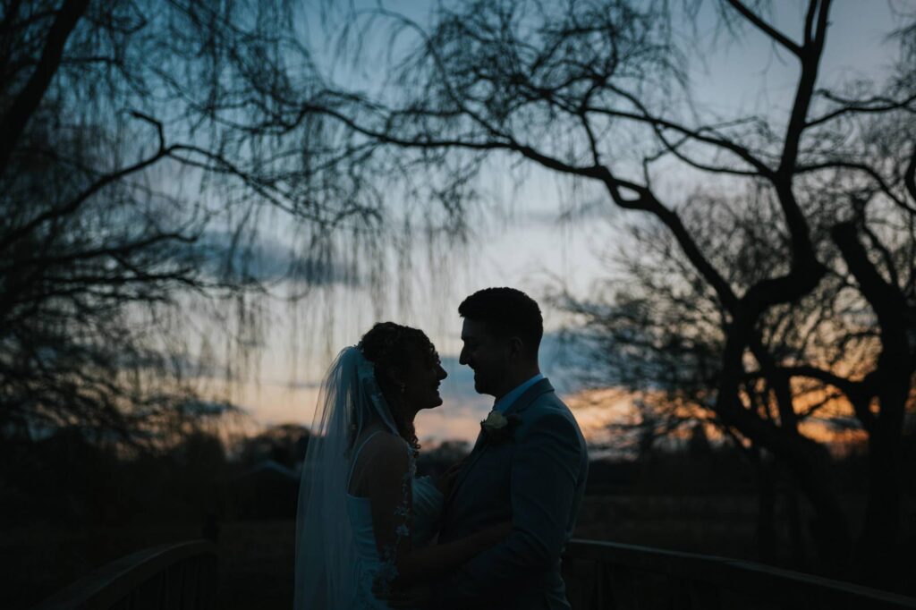 bride and groom silhouette at sunset at grosvenor pulford wedding