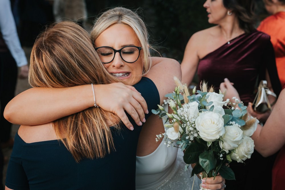 bride hugs guest