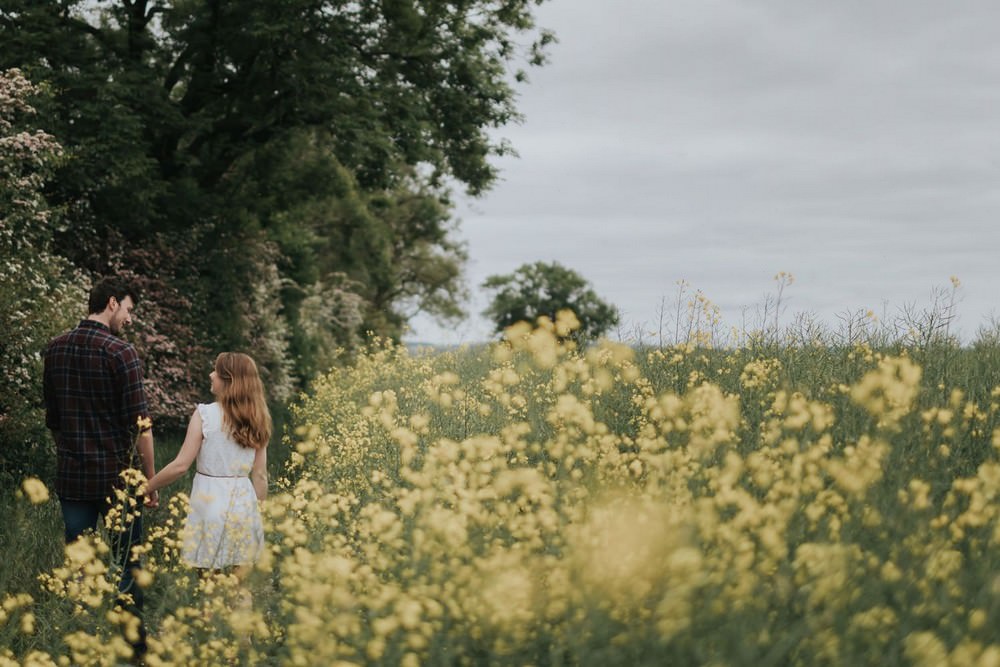 engagement shoot in field of flowers