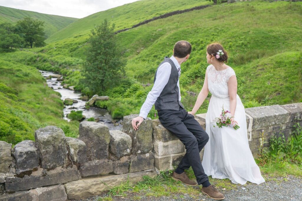 married couple looking at stream in Calderdale hills