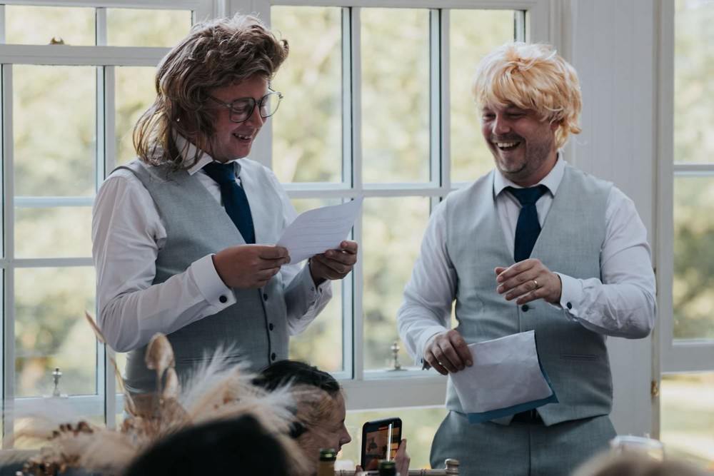 losehill house wedding groom and best man wear wigs during speeches
