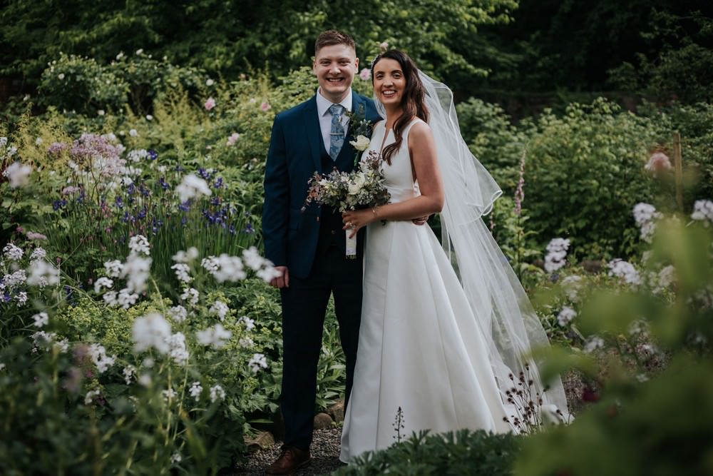 newly married couple in gardens at pendle heritage centre
